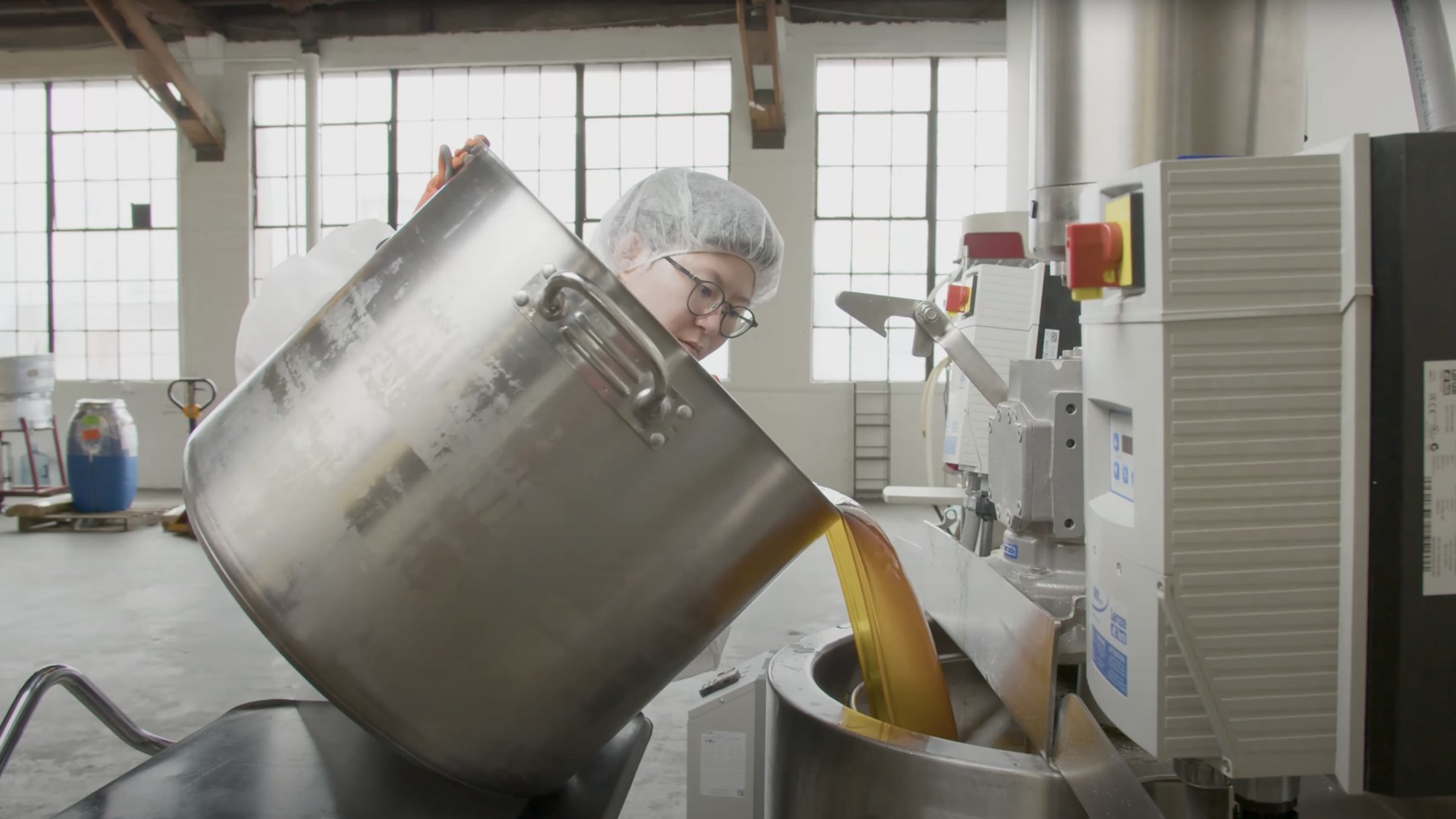 A batch being poured from a steel vessel on the production floor of the Stratia lab in Los Angeles.